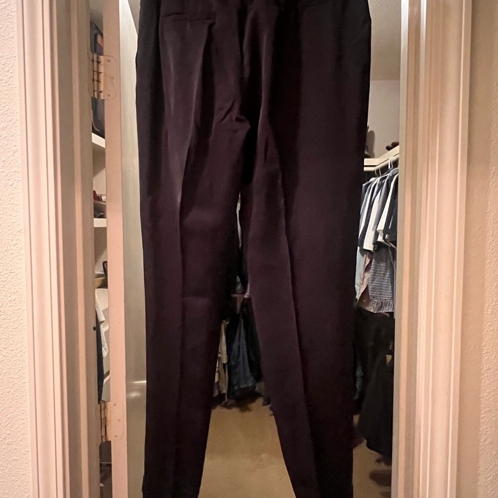 Satin pleated black pants with zip ankles